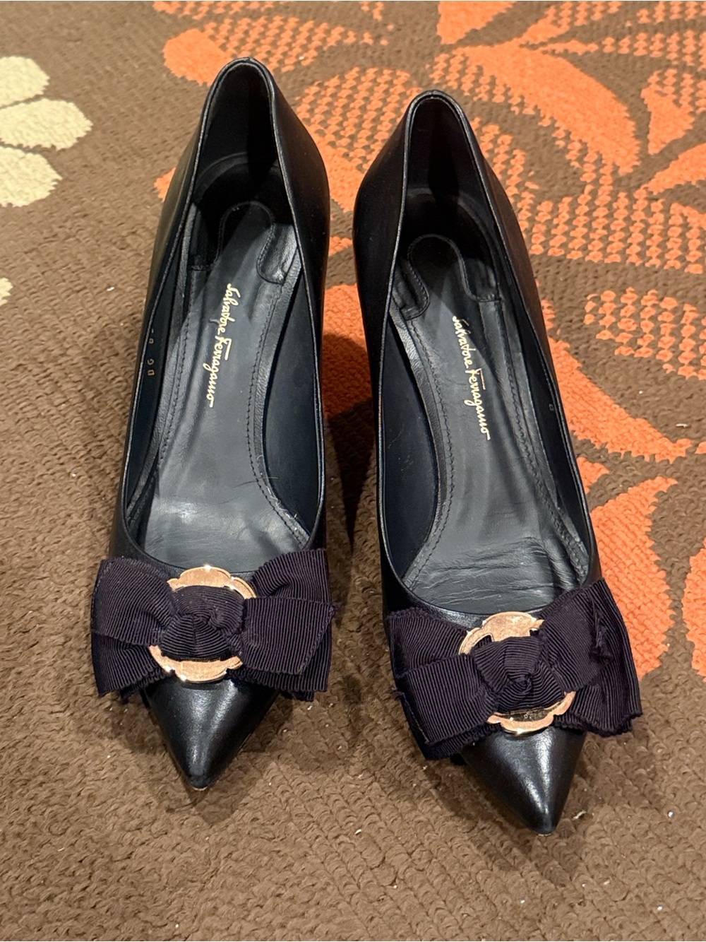Salvatore Ferragamo Black Pointed-Toe Pumps with Grosgrain Bow and Gold Accent